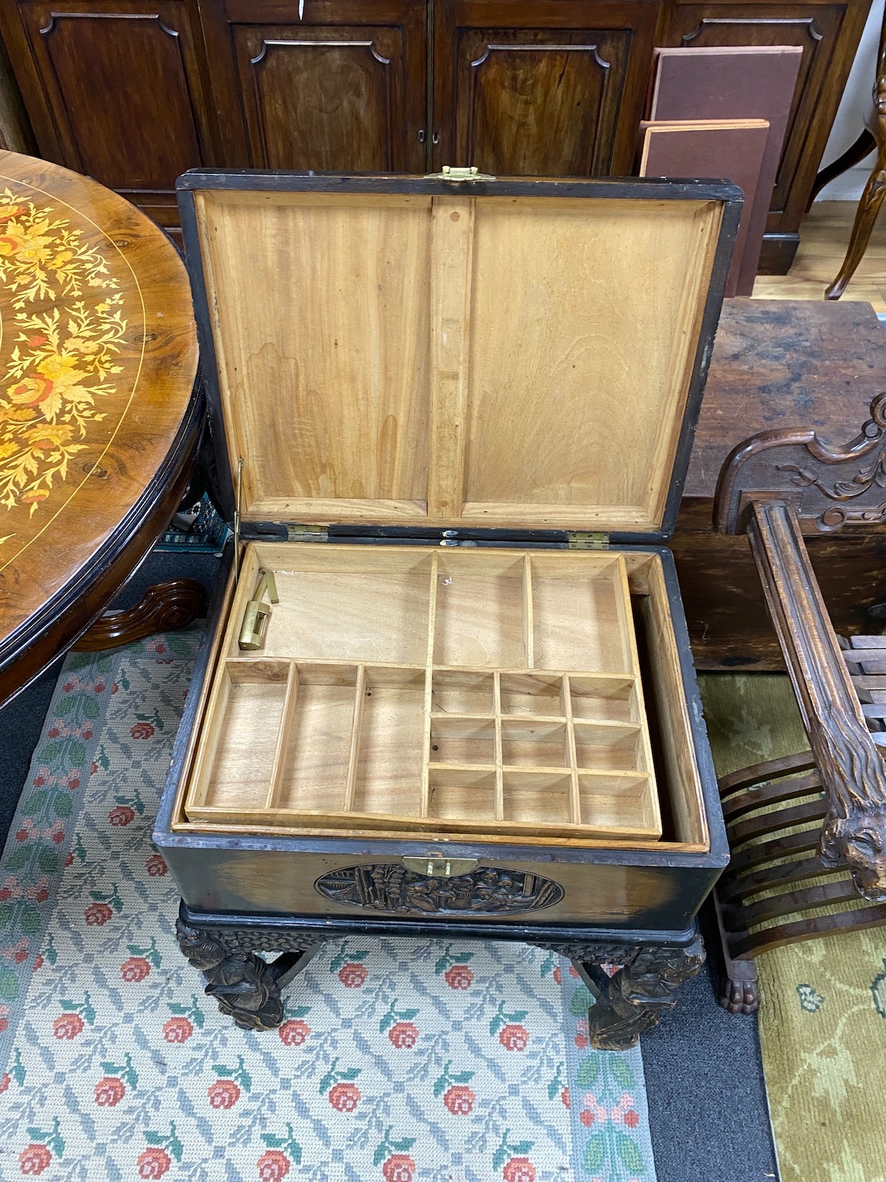 A Chinese carved camphorwood work box, width 60cm, depth 46cm, height 67cm